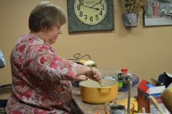 Image of Connie Moyers demonstrates a recipe at Somewhat Homemade Cooking School